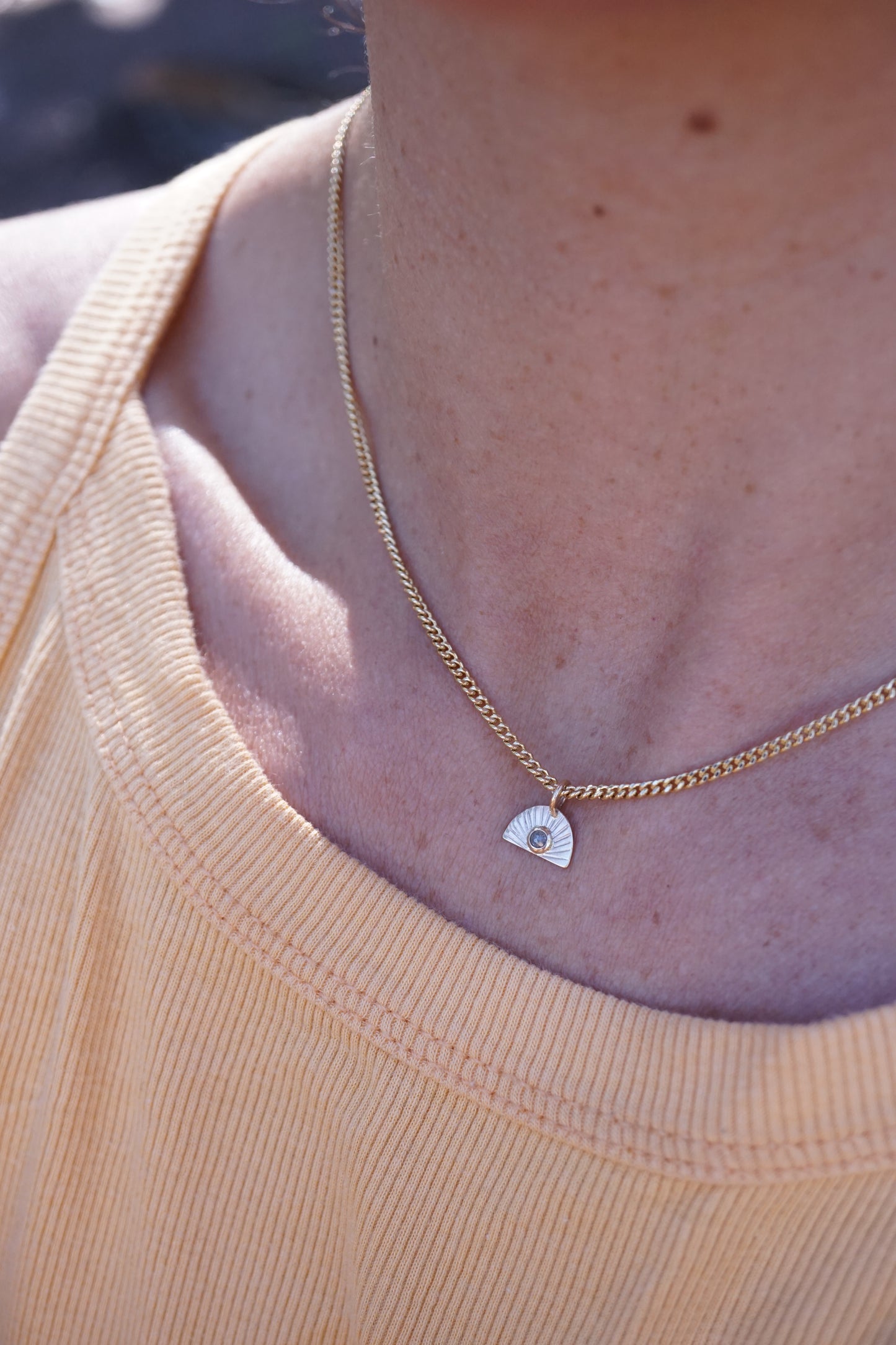 14k golden sunrise necklace with diamond