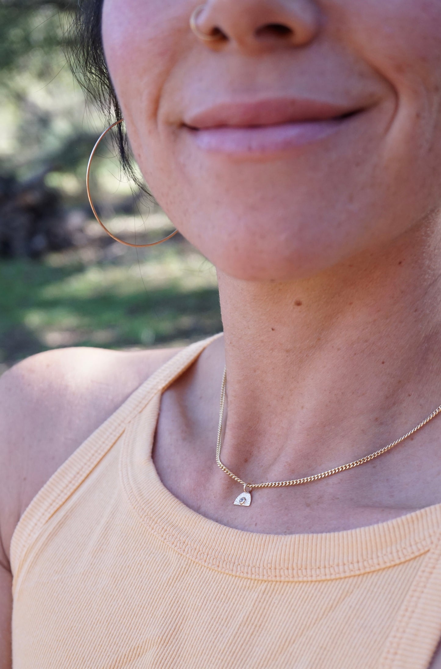 14k golden sunrise necklace with diamond