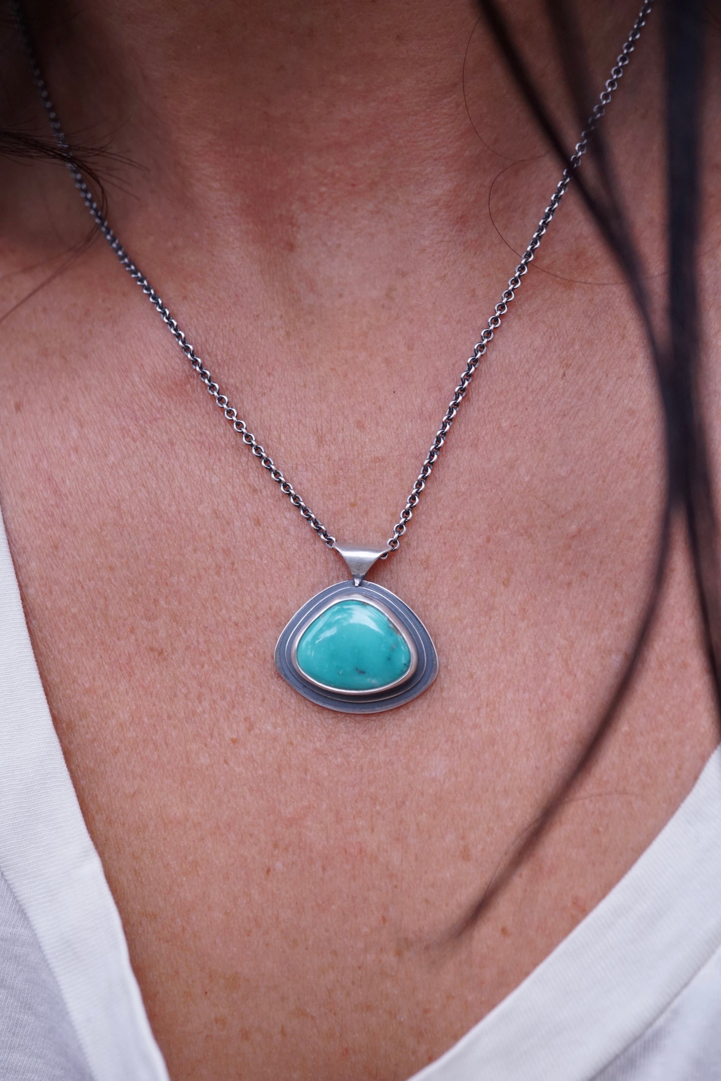 layered silver pendant with Chinese turquoise