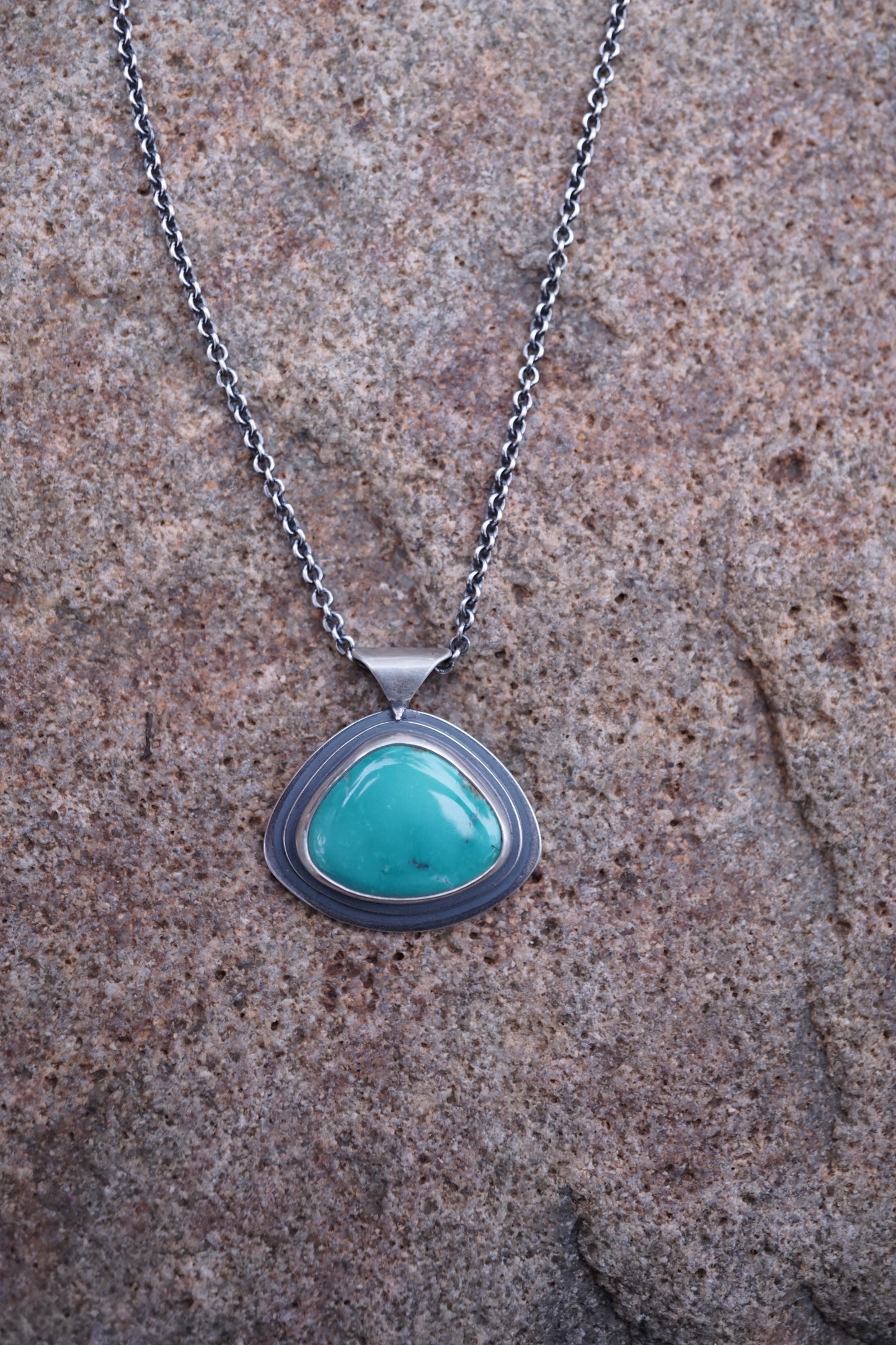 layered silver pendant with Chinese turquoise