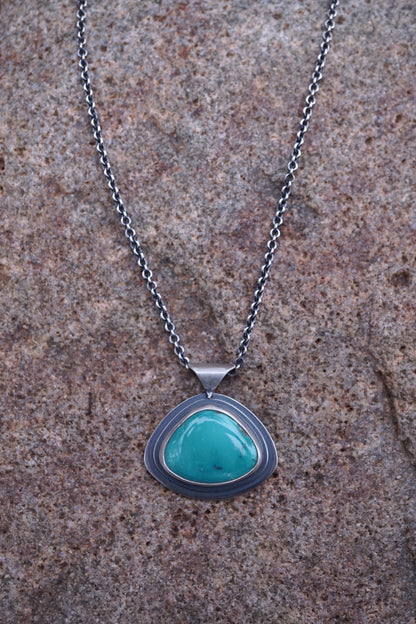 layered silver pendant with Chinese turquoise