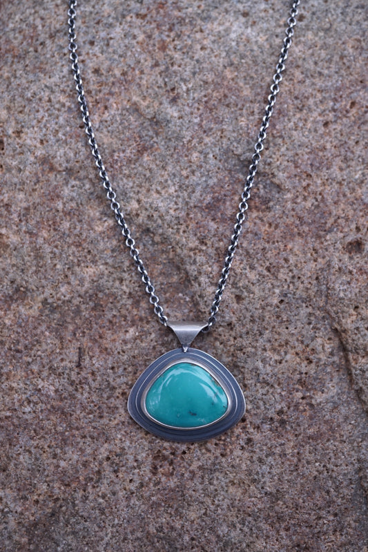 layered silver pendant with Chinese turquoise